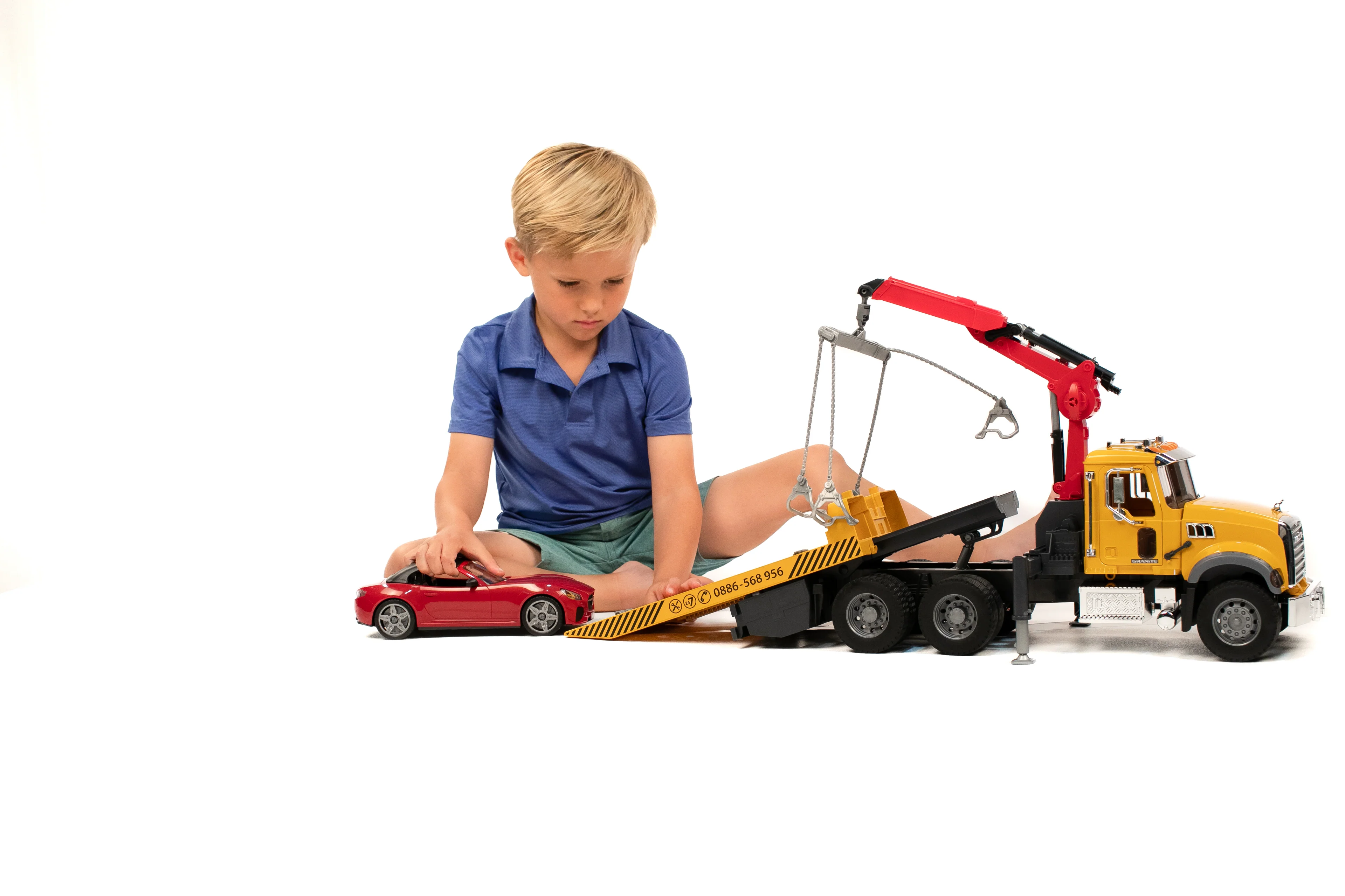Bruder Granite Tow Truck with Roadster (02829)